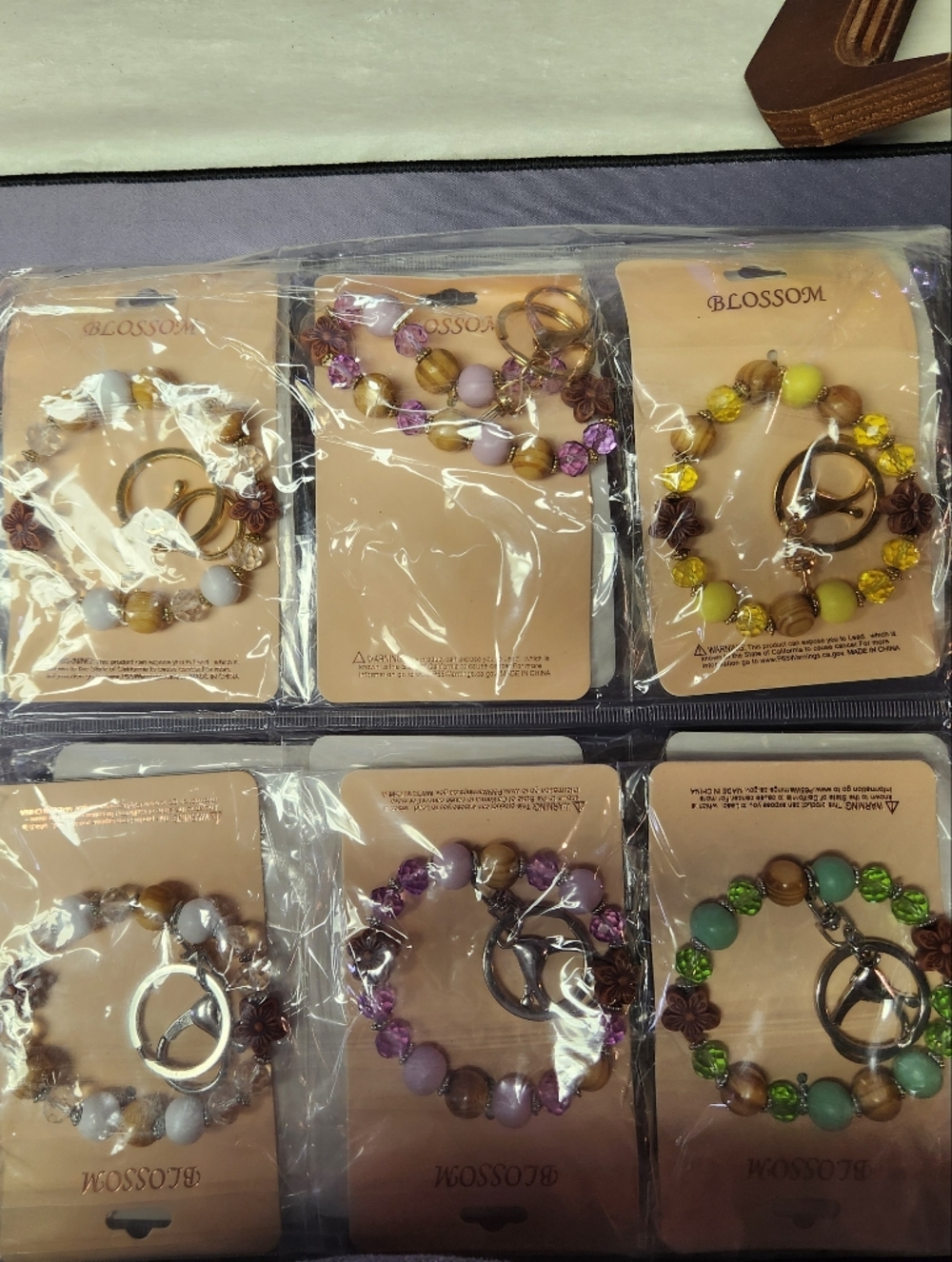 12 Piece Multicolor Beaded Bracelet Keychain - Yellow, Purple, Green, White